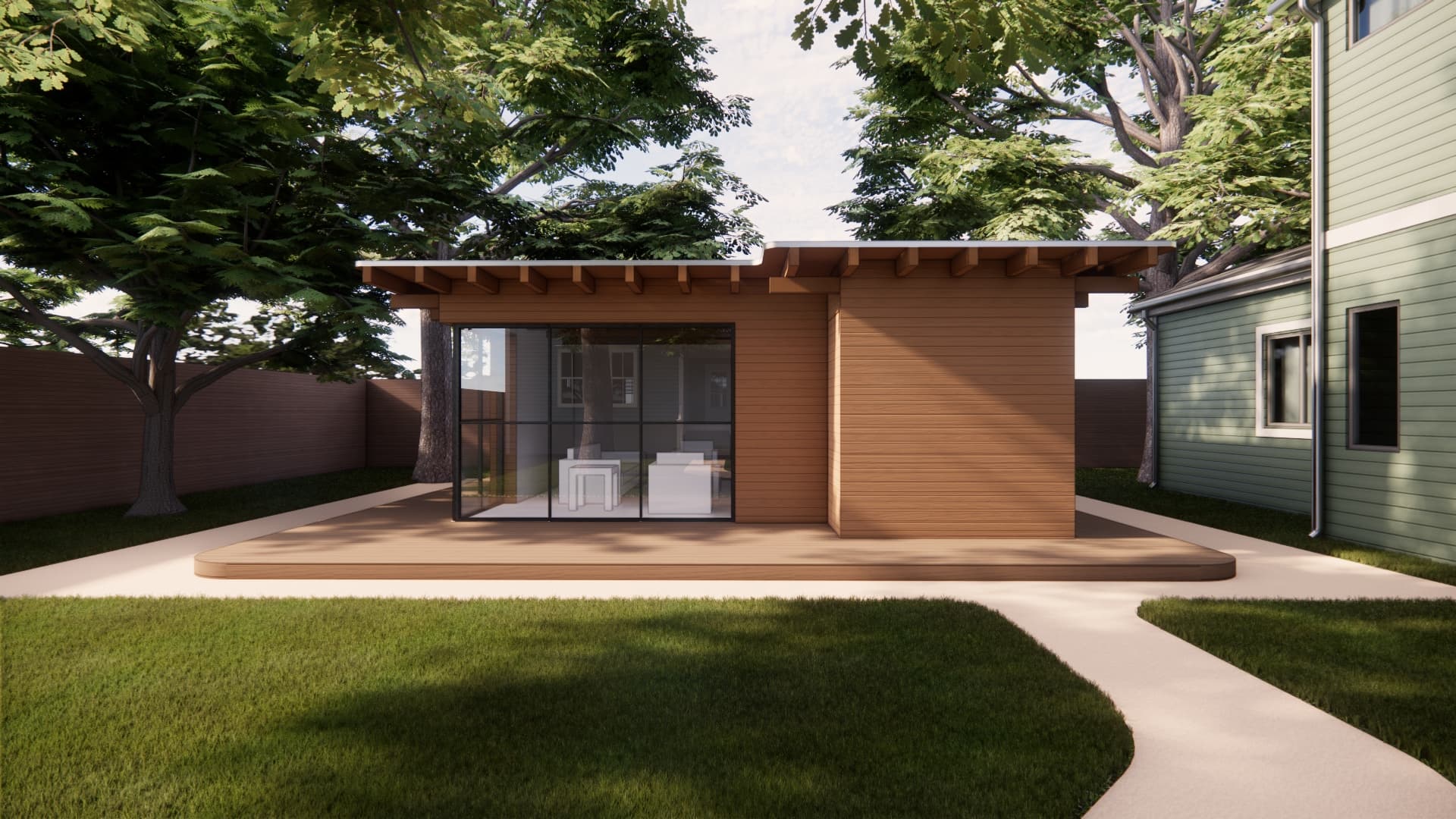 Exterior of the Member Studio unit with full-height glass doors opening to a backyard patio.